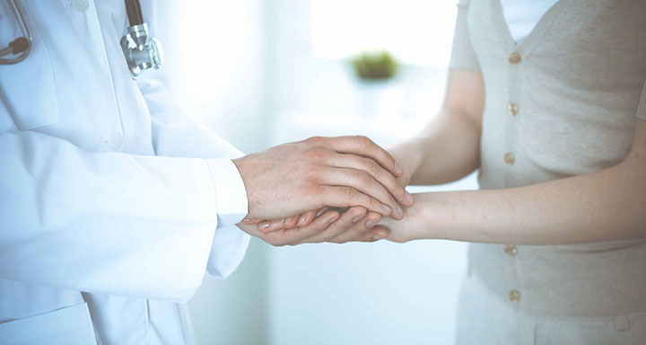 Nurse and patient hands - contact page