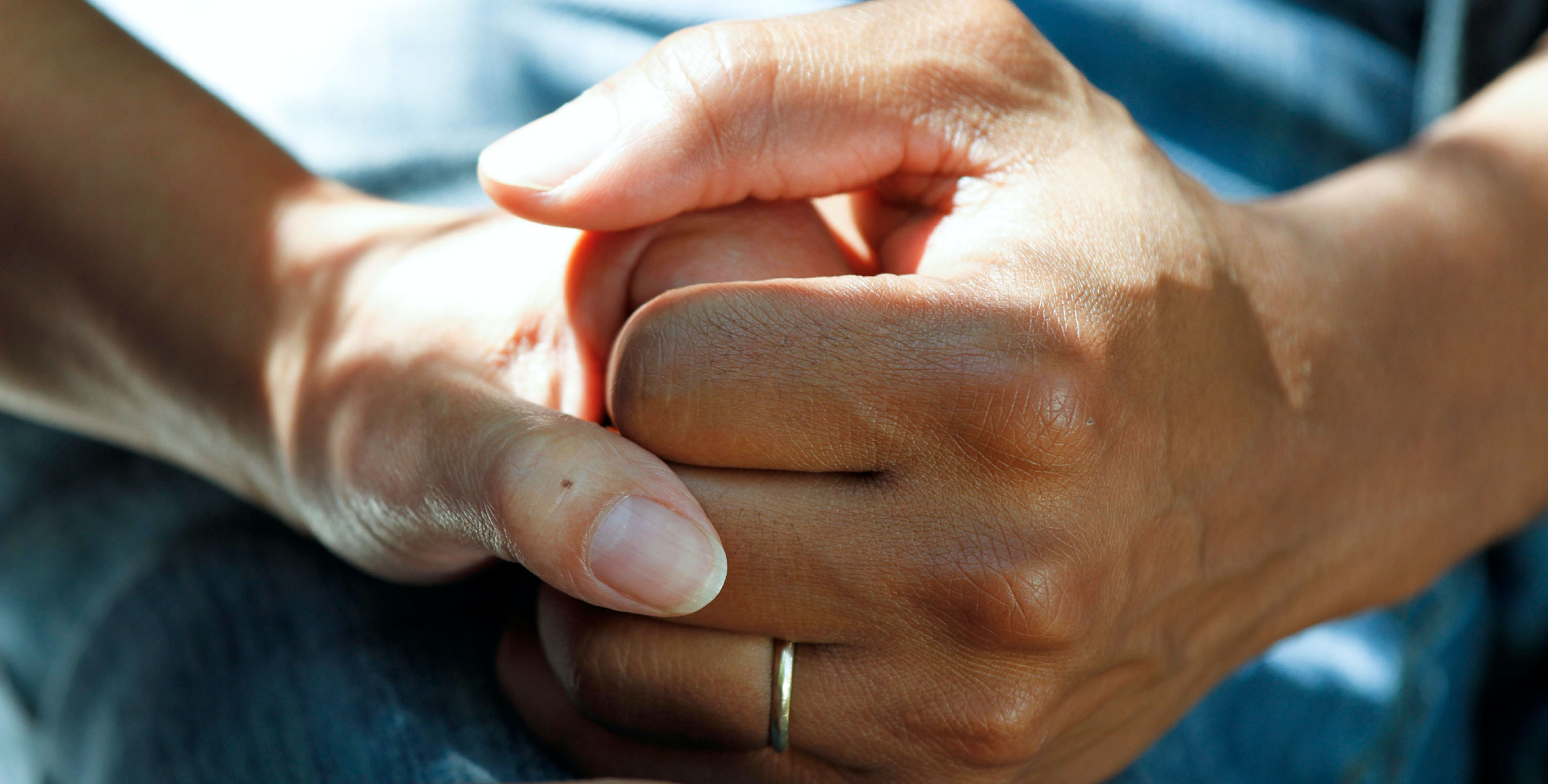 care manager holding patient's hand